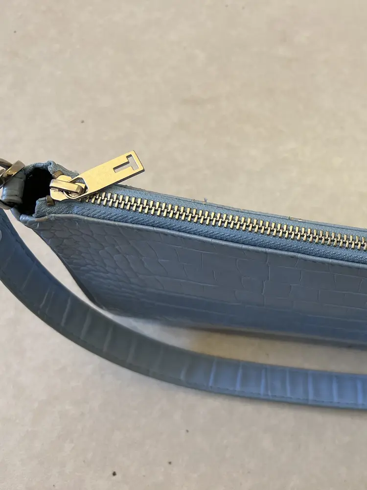 Pale blue handbag with a newly fitted zip